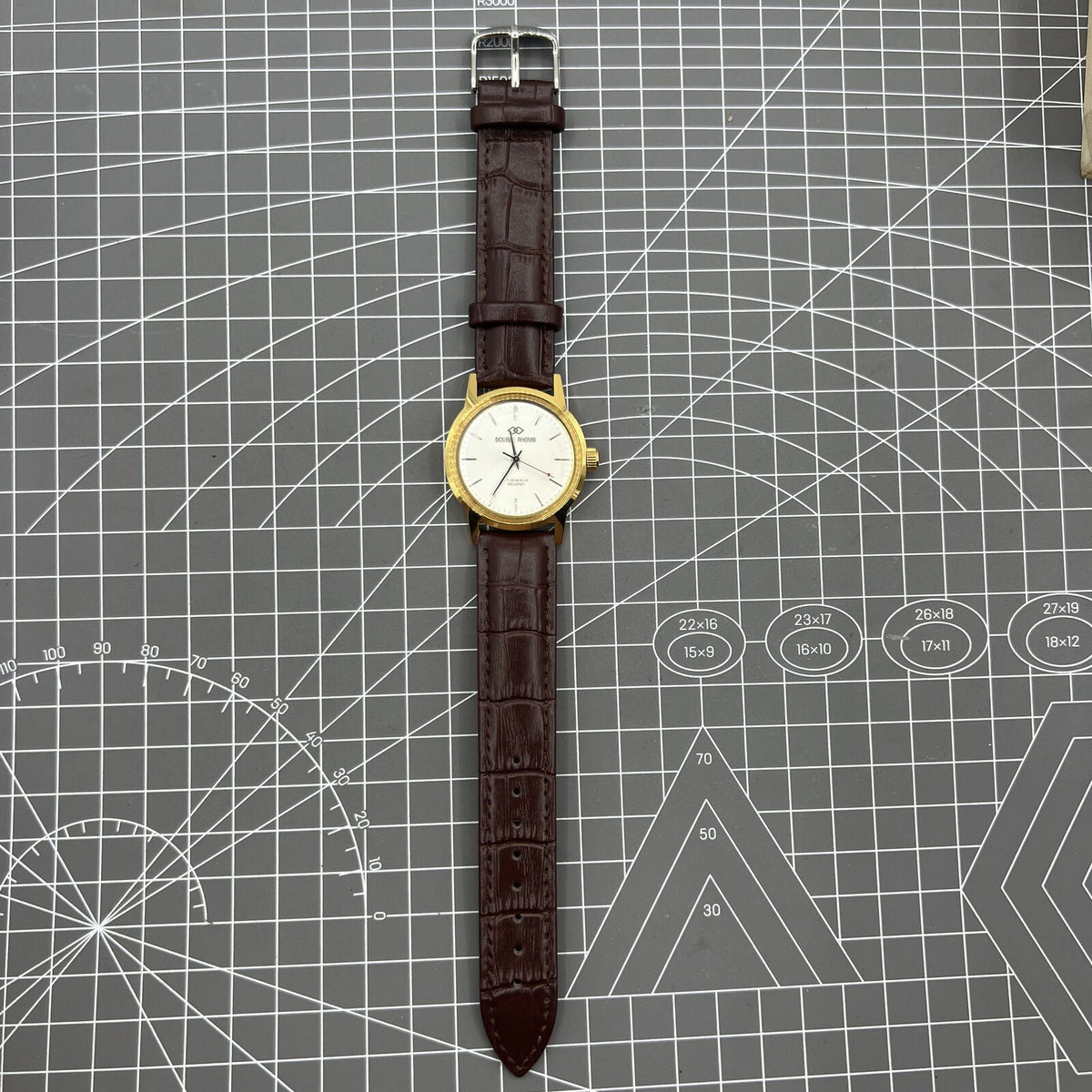 Beijing Double Rhomb mechanical watch with golden case and silver nail markers, elegant design