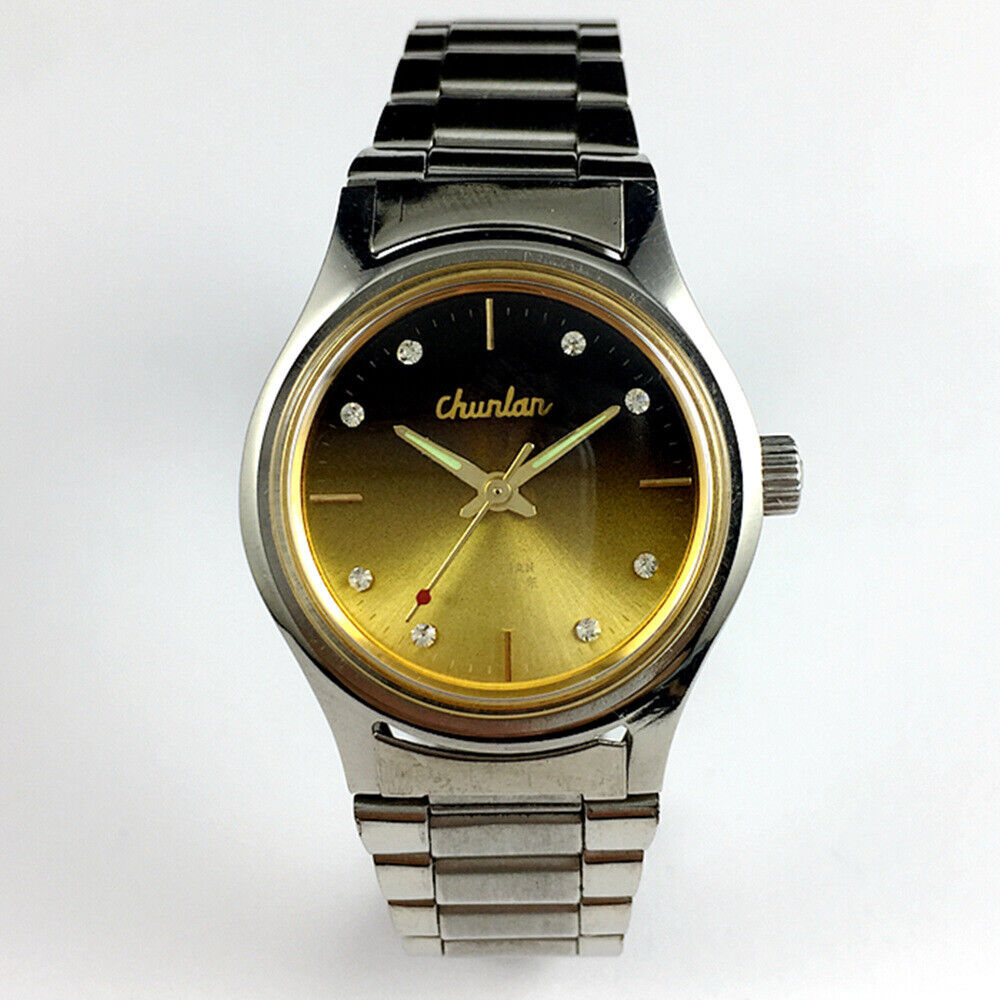 China Chunlan Steel mechanical watch with 17 jewels, gradual golden brown dial, and classic design.