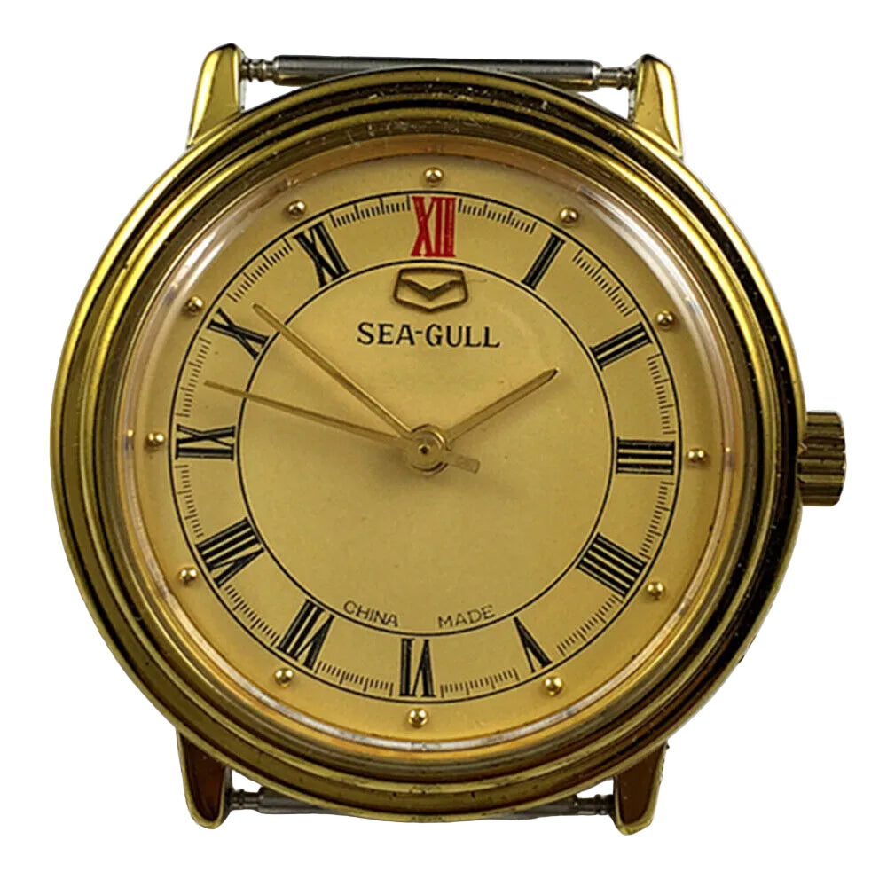 35mm Tianjin Seagull watch with golden round case and dial, manual mechanical movement, elegant design