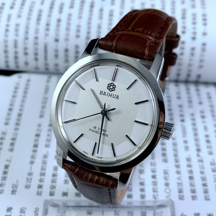 China Baihua 37mm manual mechanical watch with silver dial, 19 jewels, shock-resistant design for durability