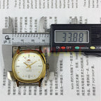 33mm HONGLIAN manual watch with gold numeral markers and square gold case, elegant accessory for daily wear.