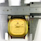 HONGLIAN manual mechanical watch with square golden case, yellow dial, and golden nail markers, elegant style.