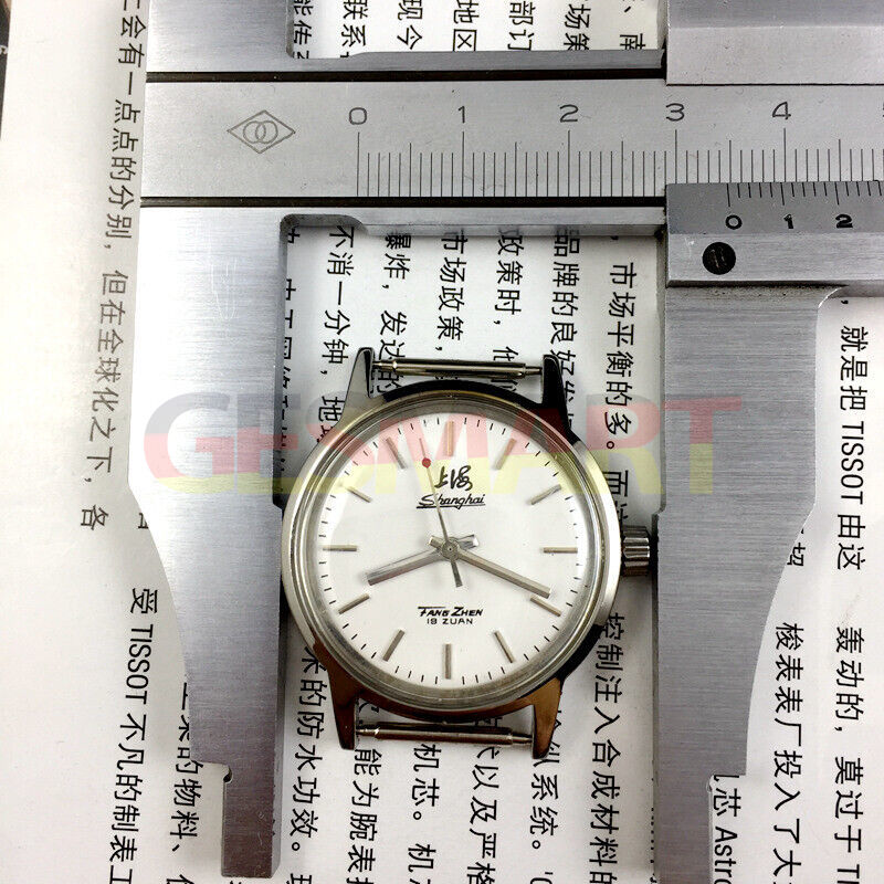 Shanghai Factory 32mm manual mechanical watch with 19 jewels, shock-resistant for durable wear.