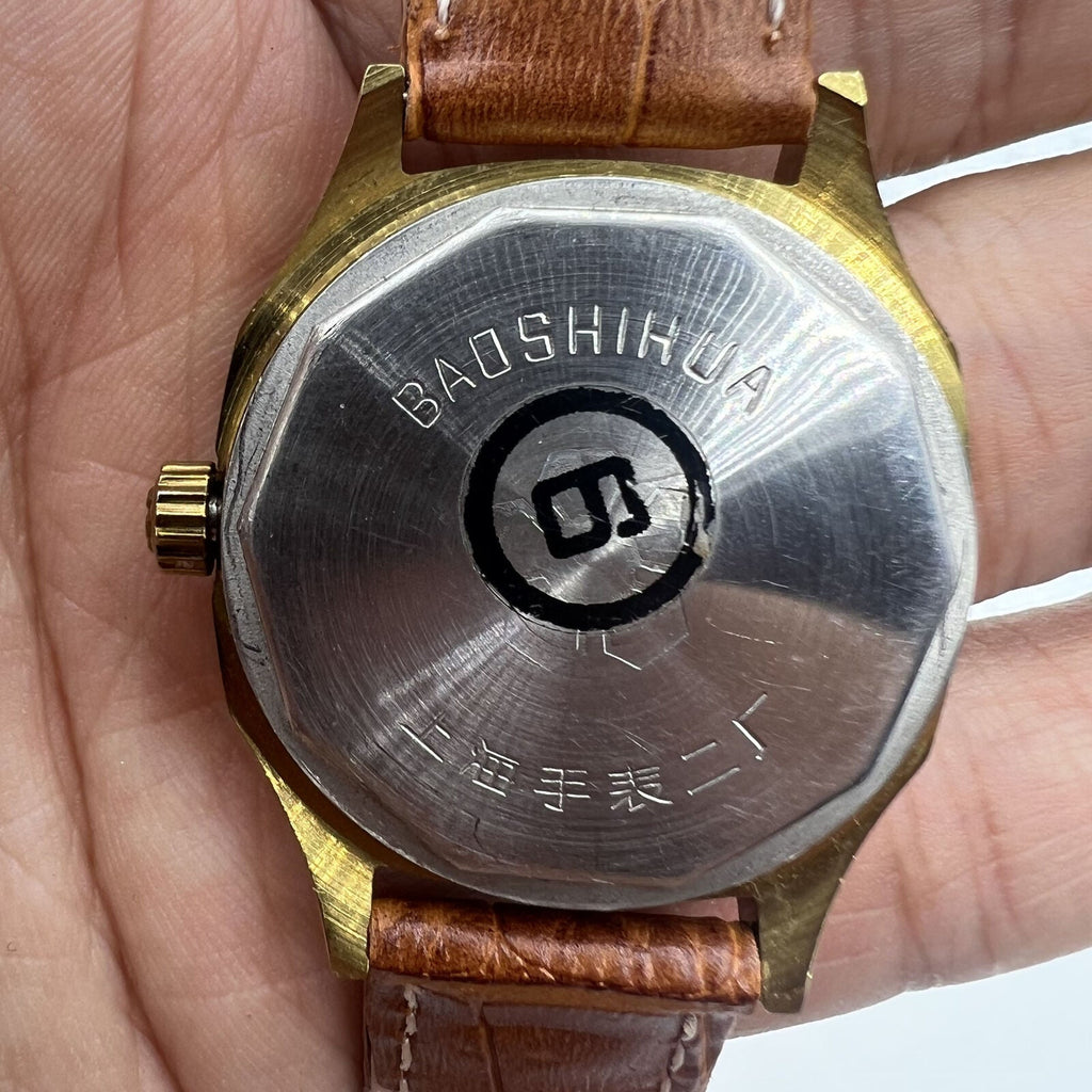 Shanghai 32mm manual mechanical watch with golden markers, brown dial, and octagonal case design.