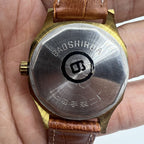 Shanghai 32mm manual mechanical watch with golden markers, brown dial, and octagonal case design.