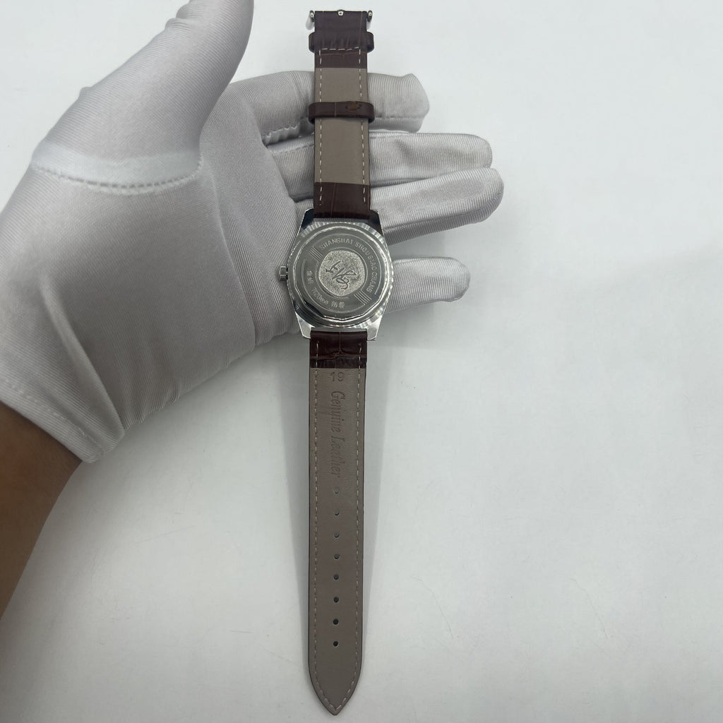 Shanghai Factory 38mm manual mechanical watch with white dial, 3 hands, and 19 jewels for precision timekeeping.