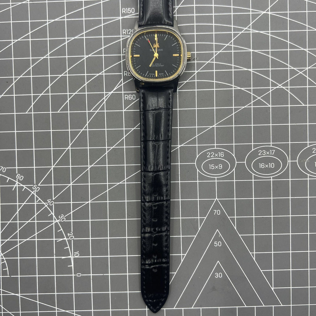 Shanghai Factory 34mm manual mechanical watch with black dial, 19 jewels, shock-resistant for daily wear.
