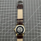 Beijing Double Rhomb mechanical watch with golden case, silver nail markers, and elegant classic design