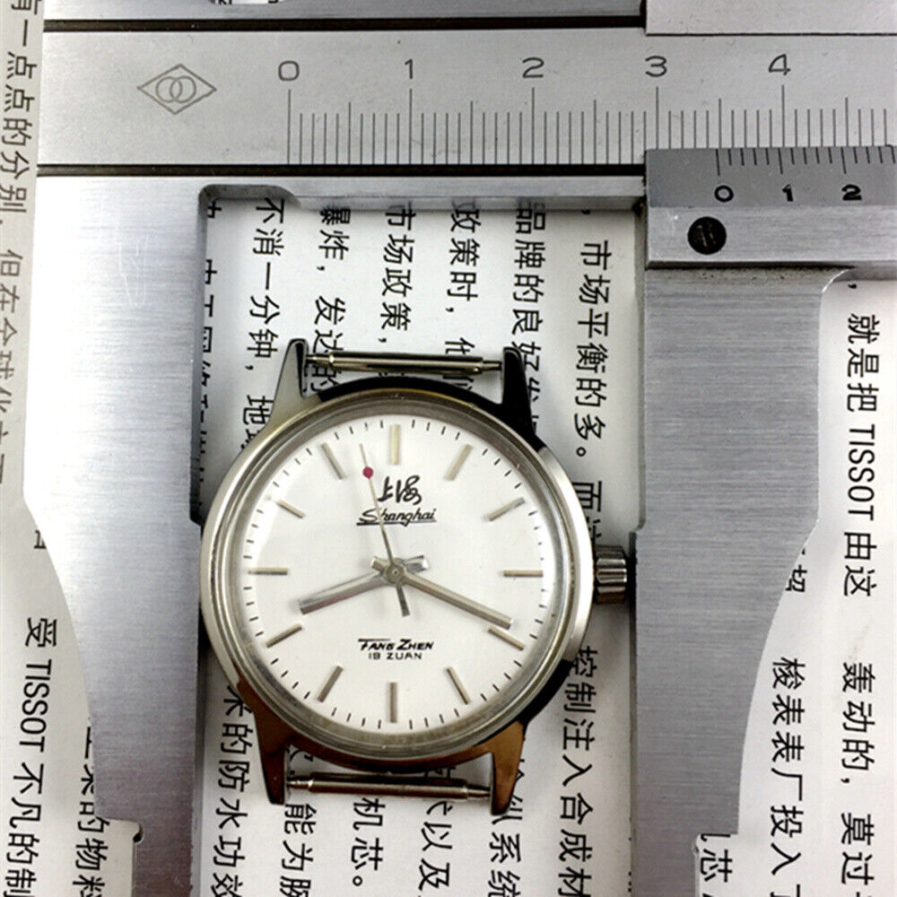 32mm Shanghai Factory manual watch with silver case, silver hour markers, classic mechanical design for timeless style