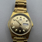 Shanghai Factory manual mechanical watch with dark brown dial and double calendar for elegant timekeeping.
