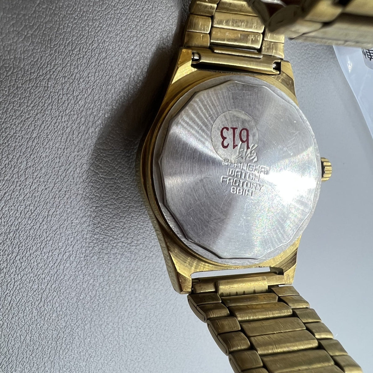 Shanghai Factory mechanical watch with dark brown dial, double calendar, classic design for daily wear.