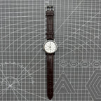 China Baihua 37mm manual mechanical watch with silver dial, 19 jewels, and shock-resistant design.