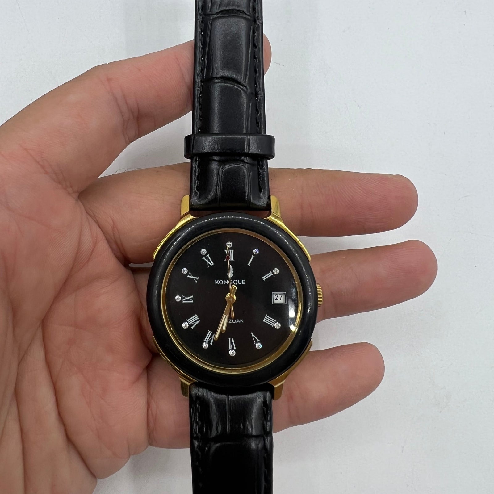 37mm Kongque automatic watch with black dial, Roman numerals, and 33 jewels for precise timing.