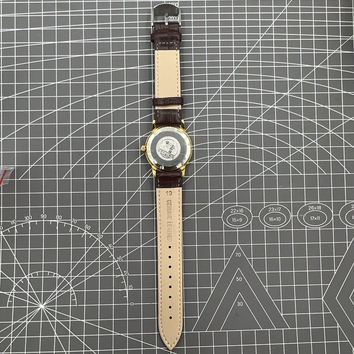 Beijing Double Rhomb mechanical watch with golden case and silver nail markers, elegant classic style for formal wear.