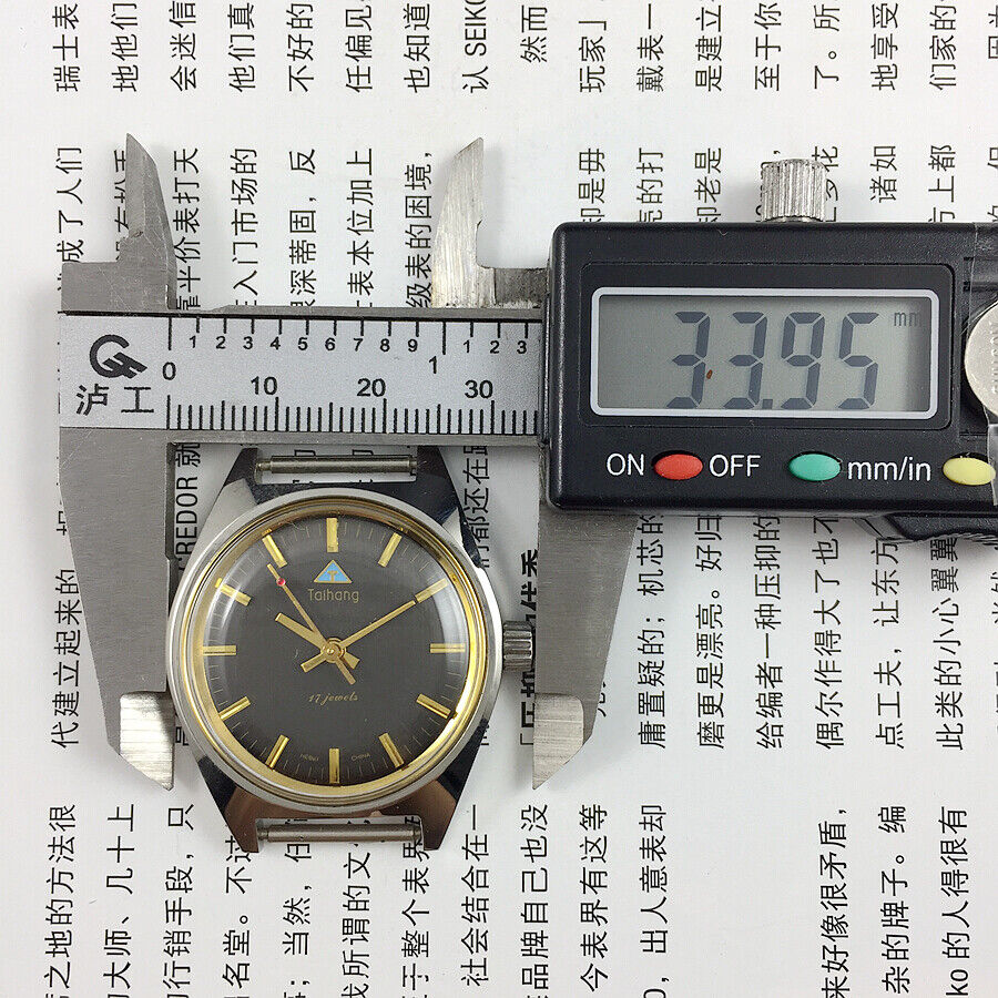 Taihang 32mm manual mechanical watch with black dial, gold markers, 17-jewel precision craftsmanship.
