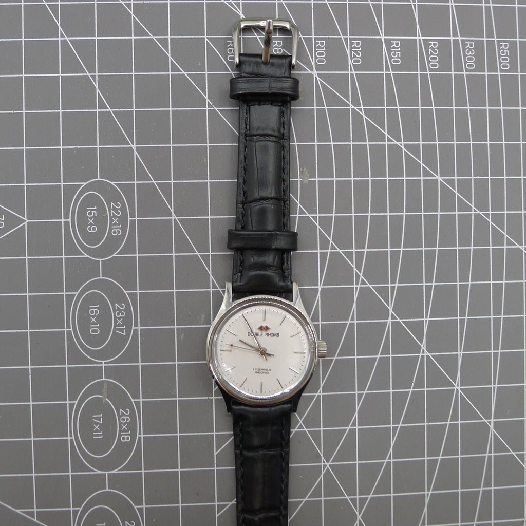 Silver 31mm Beijing Double Rhomb manual watch with three hands, elegant design for classic style.