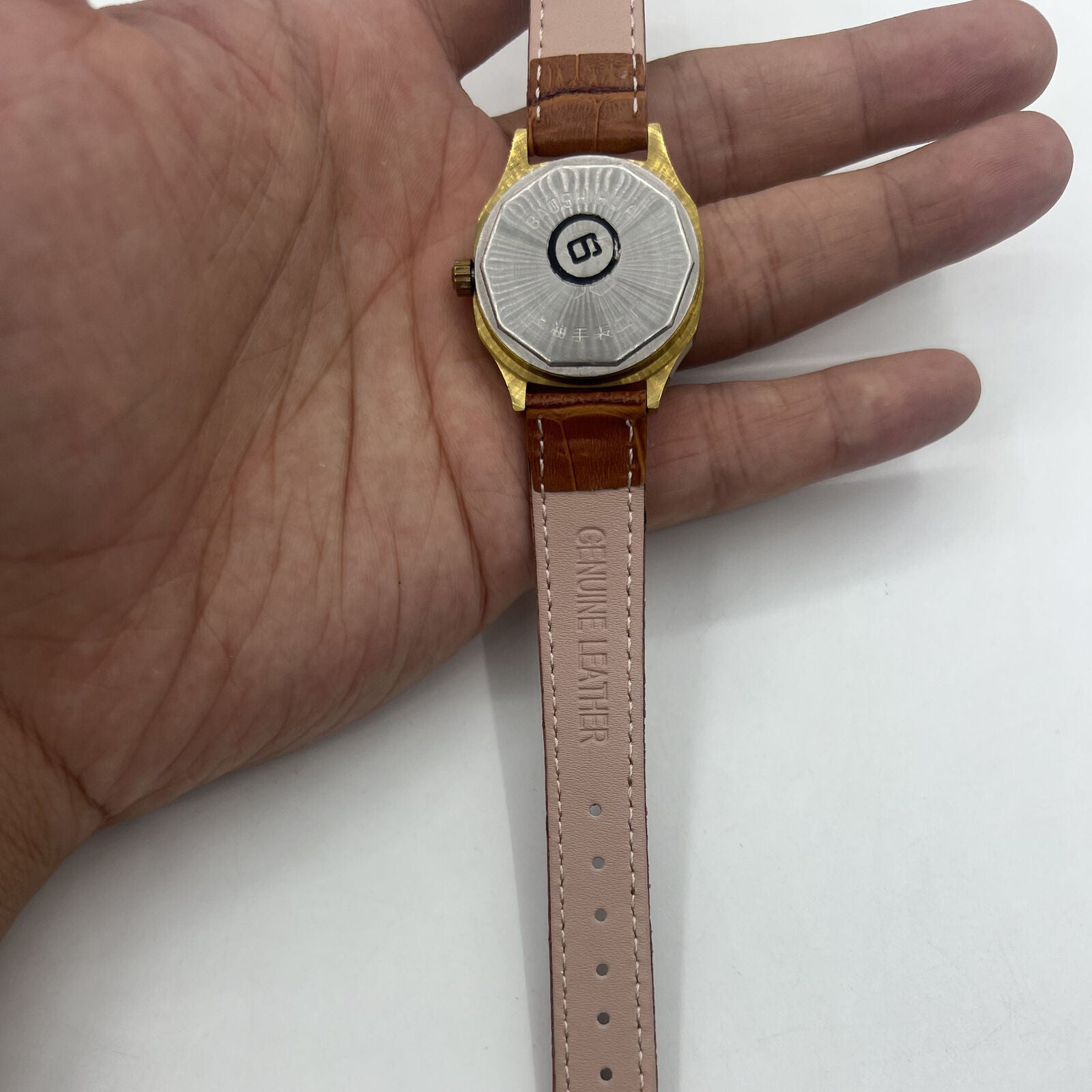 Shanghai 32mm manual mechanical watch with golden markers, brown dial, and octagonal case design for classic style.
