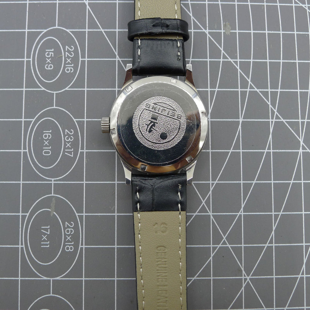 Silver 31mm Beijing Double Rhomb manual watch with three hands, sleek design for elegant style.