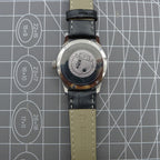 Silver 31mm Beijing Double Rhomb manual watch with three hands, sleek design for elegant style.