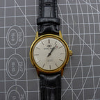 Beijing Double Rhomb watch with golden case, silver nail markers, manual movement, classic style accessory.