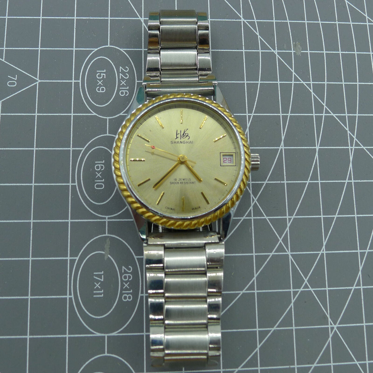 Shanghai Factory 36.5mm manual mechanical watch with 19 jewels, shock-resistant design for durability.
