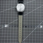Taihang 32mm manual mechanical watch with black strap, gold markers, and black dial for classic elegance.