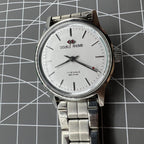 Beijing 31mm manual mechanical watch with silver case, three hands, classic China-made elegance.