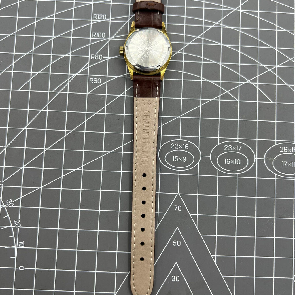 Brown 26mm Liaocheng TAISHAN manual mechanical lady watch with 19 jewels and gold nail markers, elegant design.
