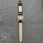 Beijing Double Rhomb manual watch, gold case with silver nail markers, classic vintage style accessory.