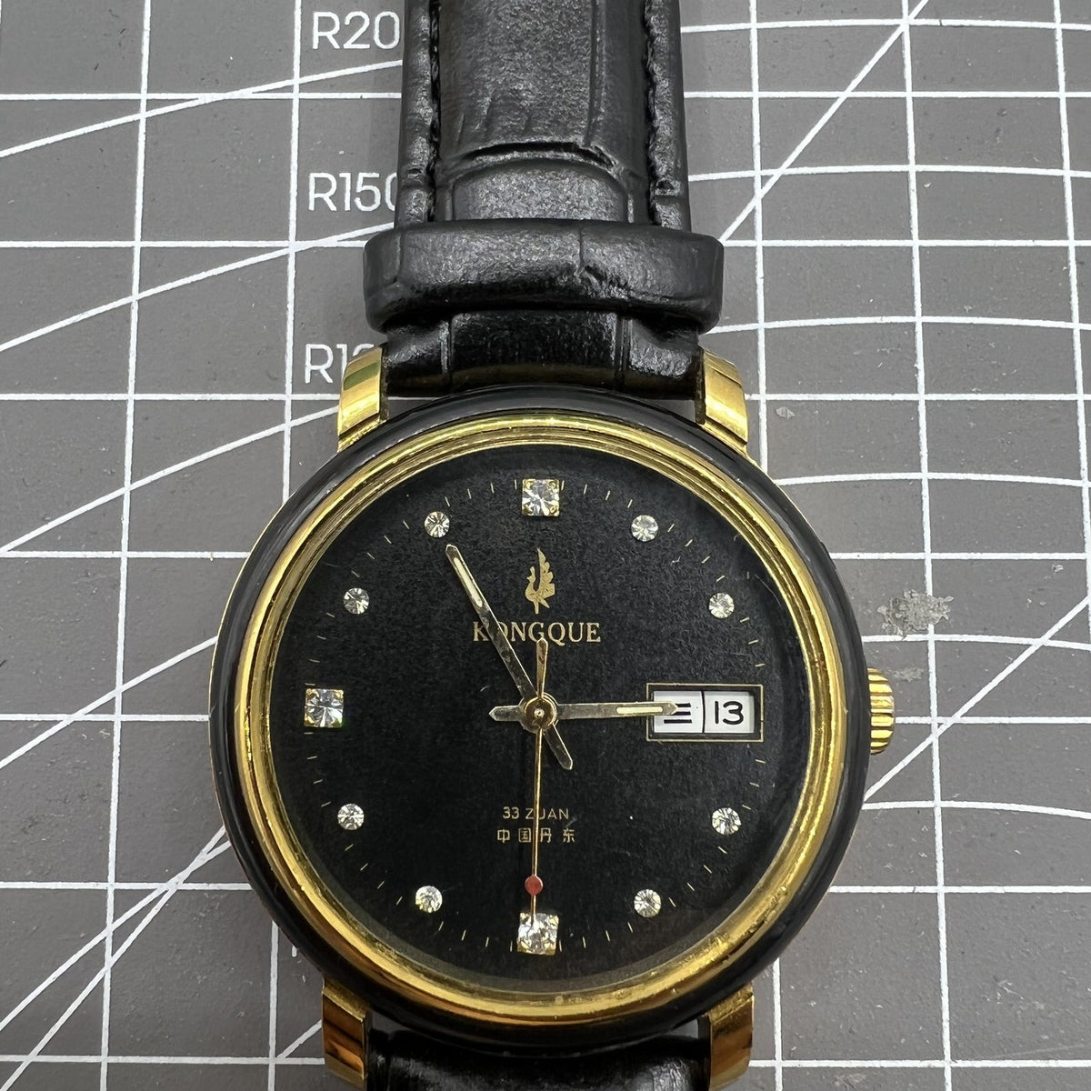 37mm Kongque automatic watch with black dial, double calendar, 33 jewels, and precise mechanical movement for stylish timekeeping.