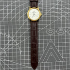 Beijing Double Rhomb manual watch featuring a golden case and silver nail markers, classic style accessory for elegant timekeeping.