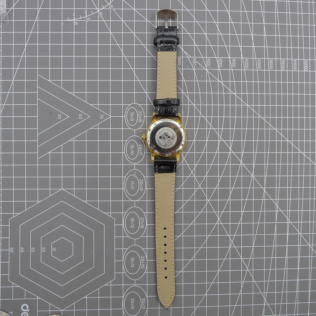 Beijing Double Rhomb mechanical watch with golden case, silver hour markers, and elegant minimalist design.