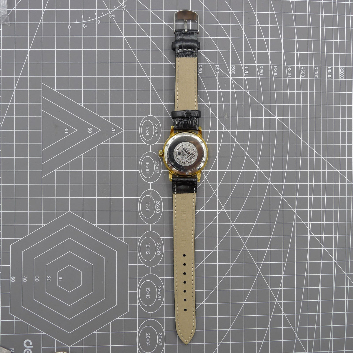 Beijing Double Rhomb mechanical watch with golden case, silver hour markers, and elegant minimalist design.