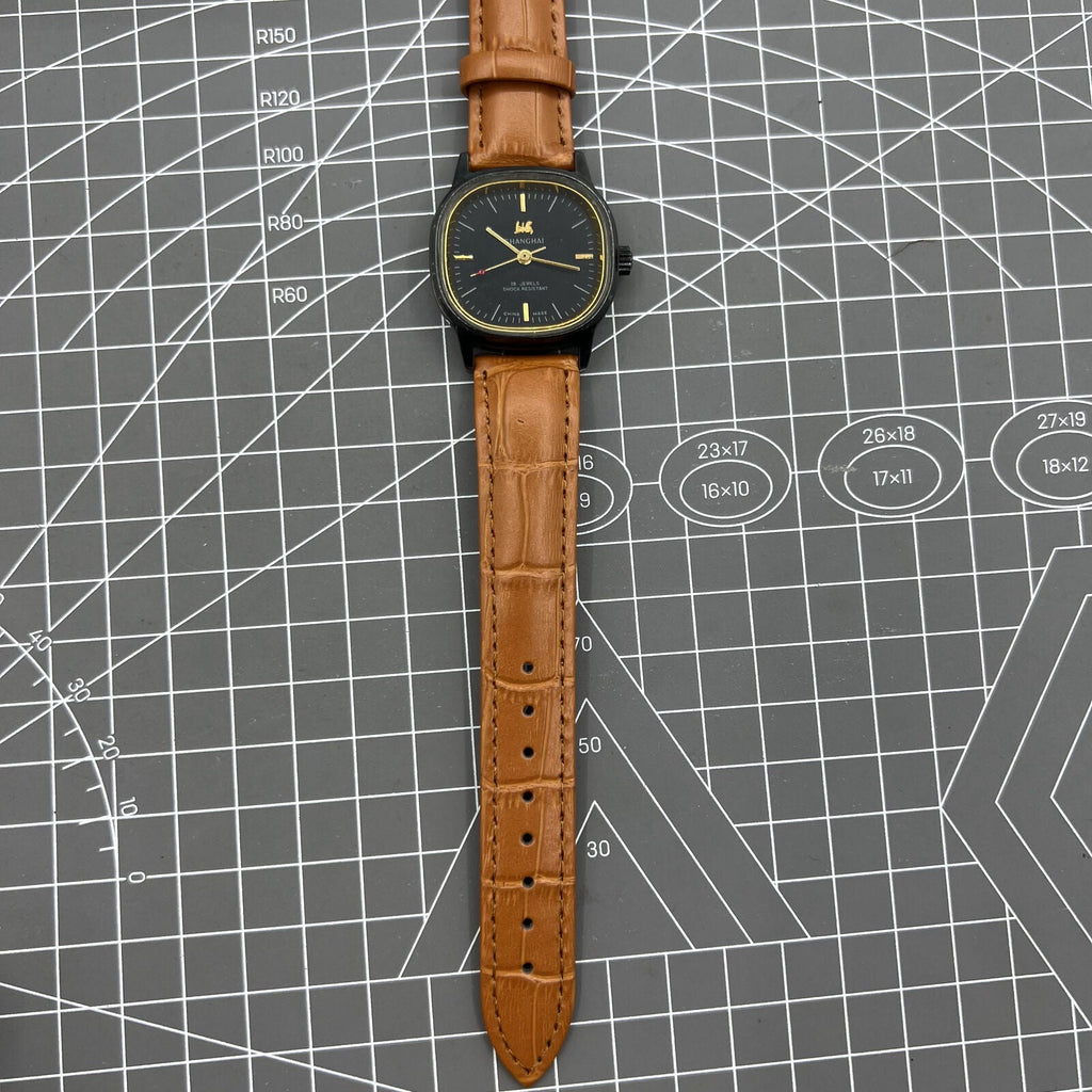 34mm Shanghai Factory manual watch with black dial, 19 jewels, shock-resistant mechanical design.