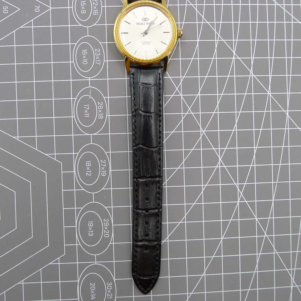 Beijing Double Rhomb mechanical watch with golden case, silver hour markers, and elegant classic style.