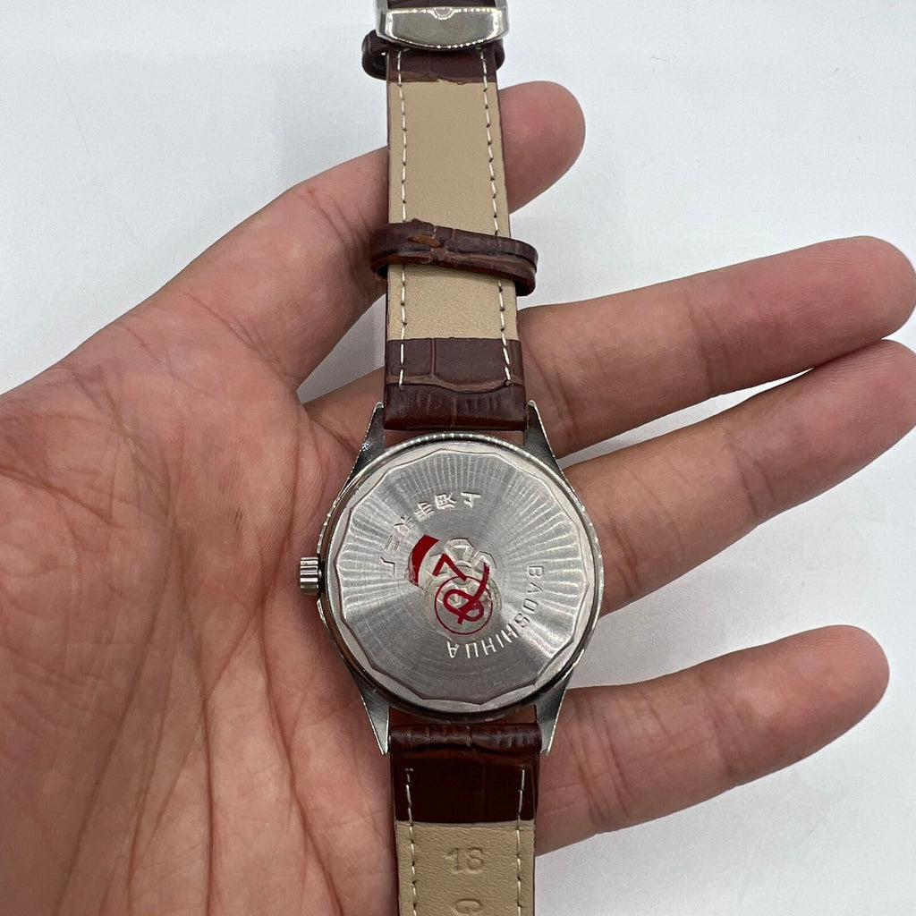 Shanghai 37mm manual watch with golden dial and nail markers, mechanical 17 jewel movement, classic round case by Shanghai.