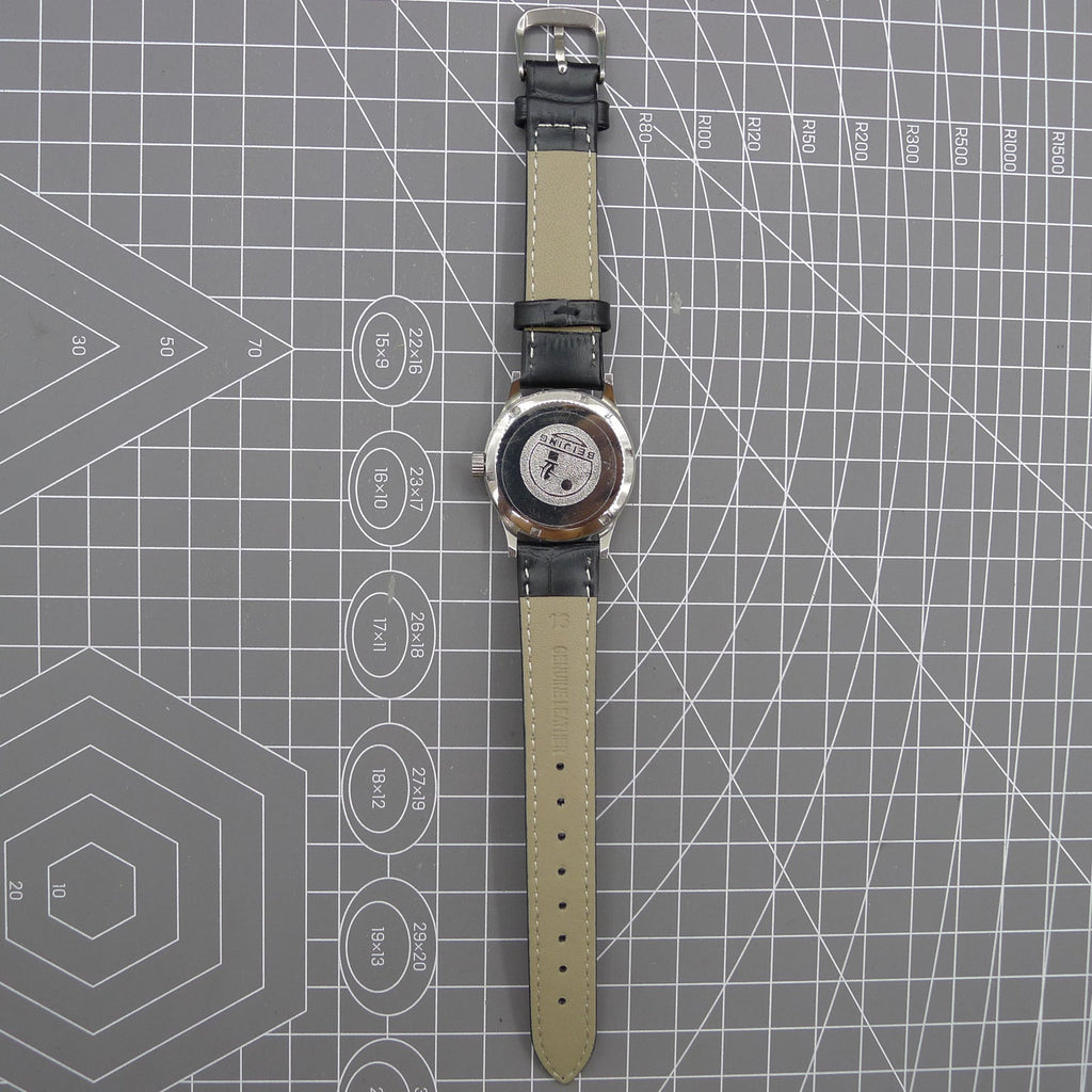 Beijing 31mm manual mechanical watch with silver case, double rhomb dial, showcasing classic Chinese craftsmanship.