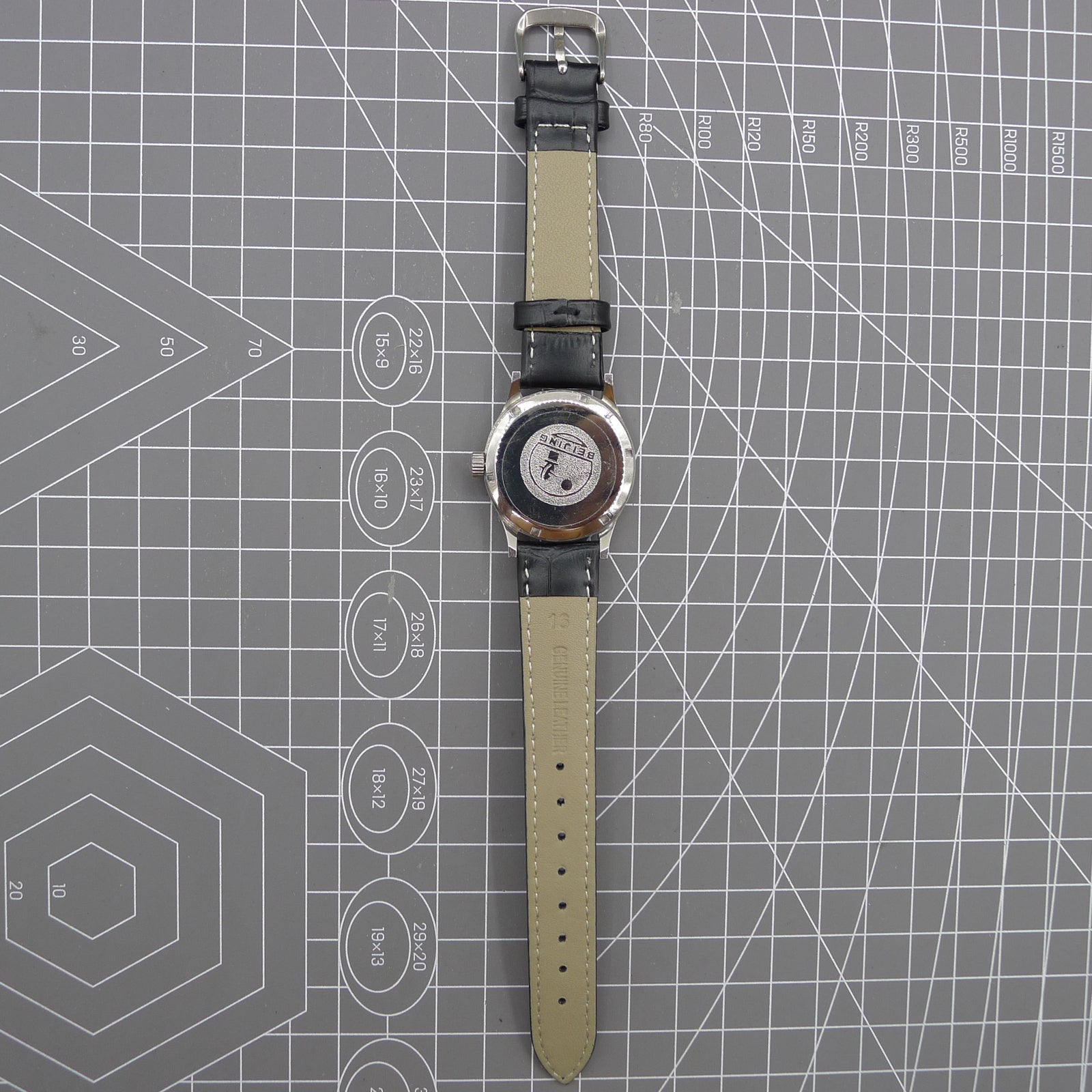 Beijing 31mm manual mechanical watch with silver case, double rhomb dial, showcasing classic Chinese craftsmanship.