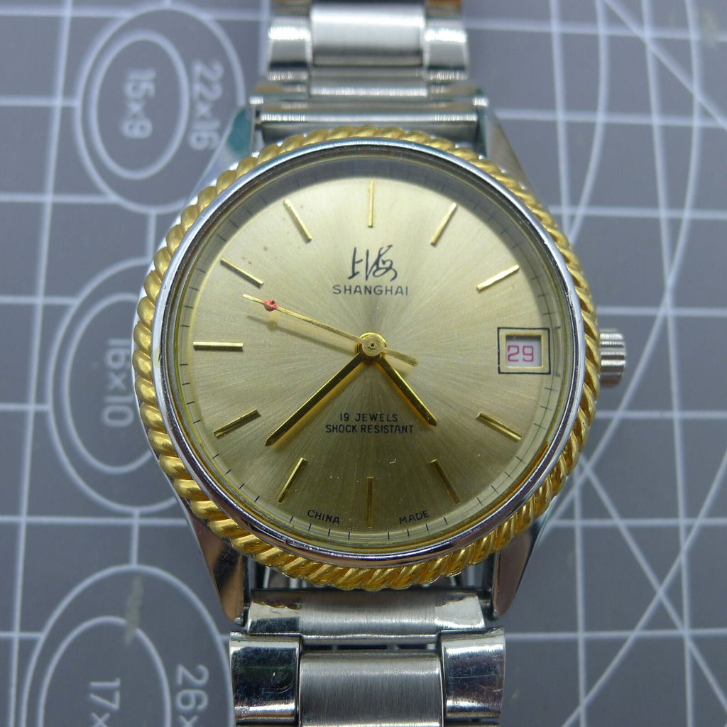 Shanghai Factory 36.5mm manual mechanical watch with 19 jewels, shock-resistant for daily wear durability.