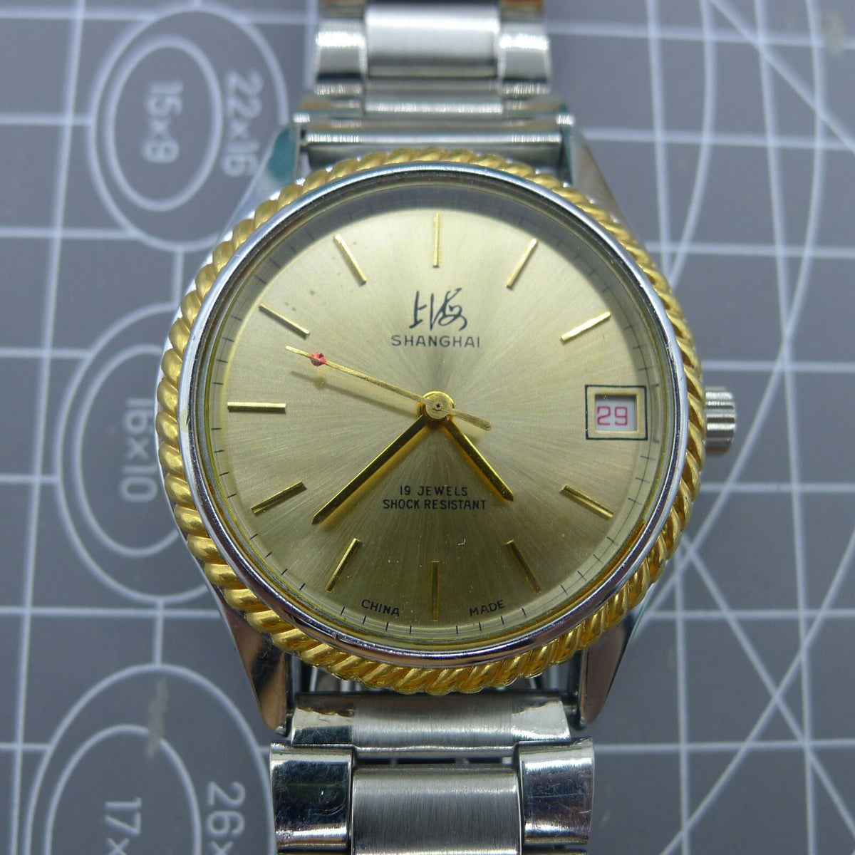 Shanghai Factory 36.5mm manual mechanical watch with 19 jewels, shock-resistant for daily wear durability.