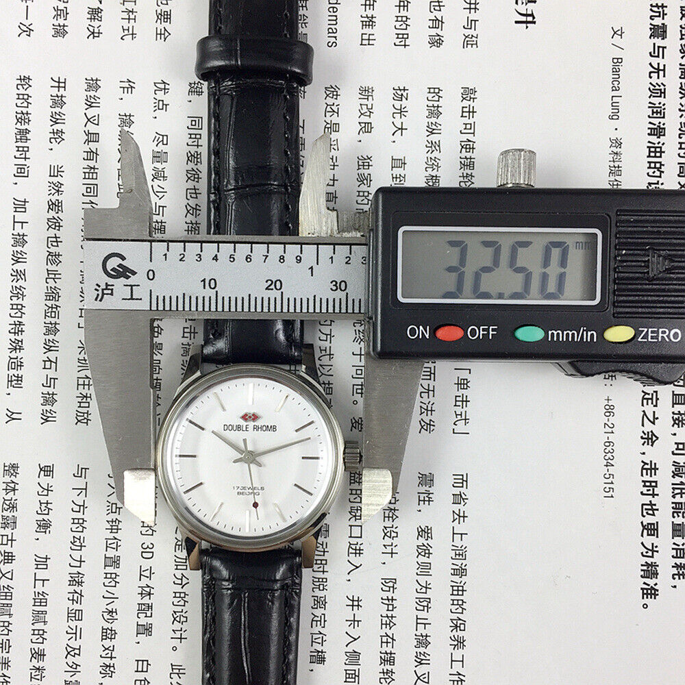 Beijing 31mm manual mechanical watch with silver case and double rhomb dial, classic Chinese craftsmanship.