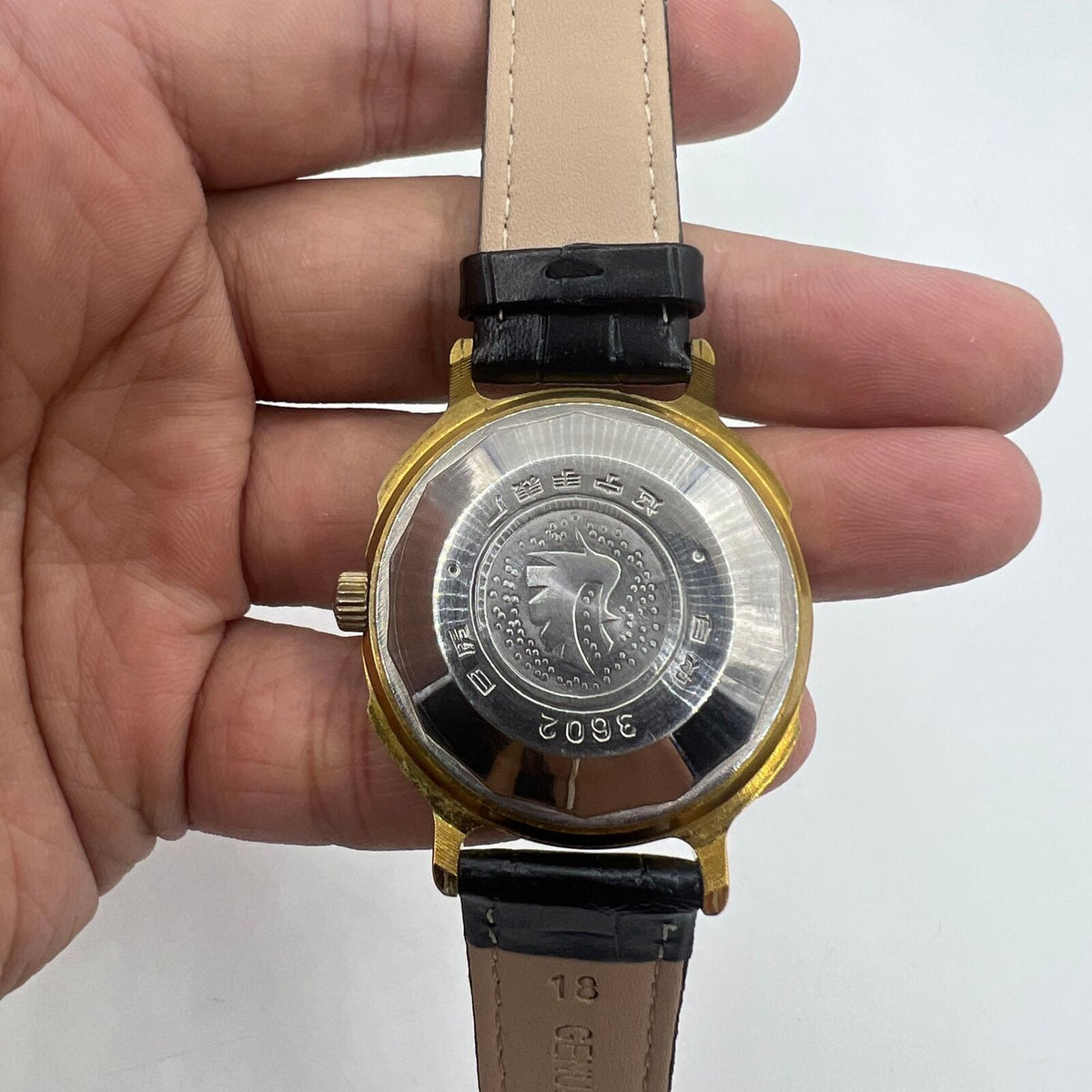 37mm automatic watch with black dial, gold Roman numerals, 33 jewels for elegant style.
