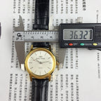 Beijing Double Rhomb mechanical watch, golden case with silver nail markers, classic elegant design for formal wear