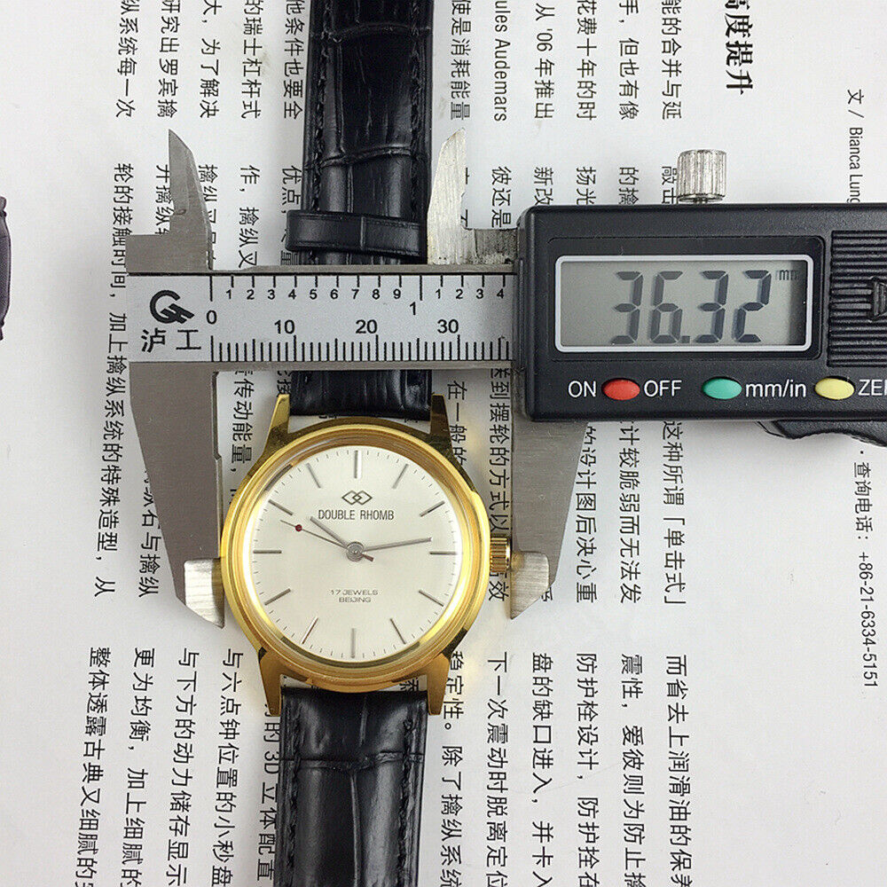 Beijing Double Rhomb mechanical watch, golden case with silver nail markers, classic elegant design for formal wear