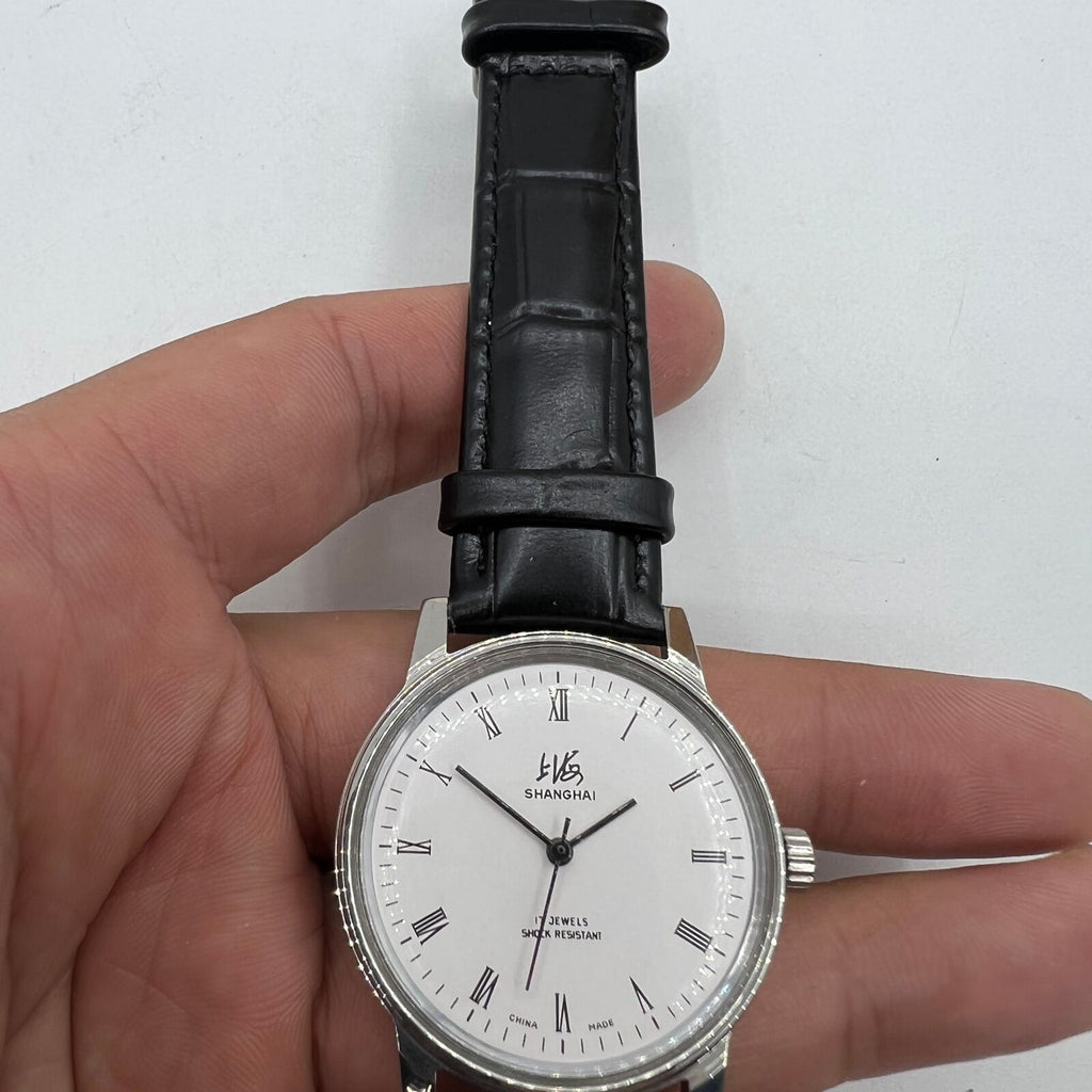 Vintage 36mm Shanghai Factory 8120 manual mechanical watch with 17-jewel shock-resistant movement, classic style.