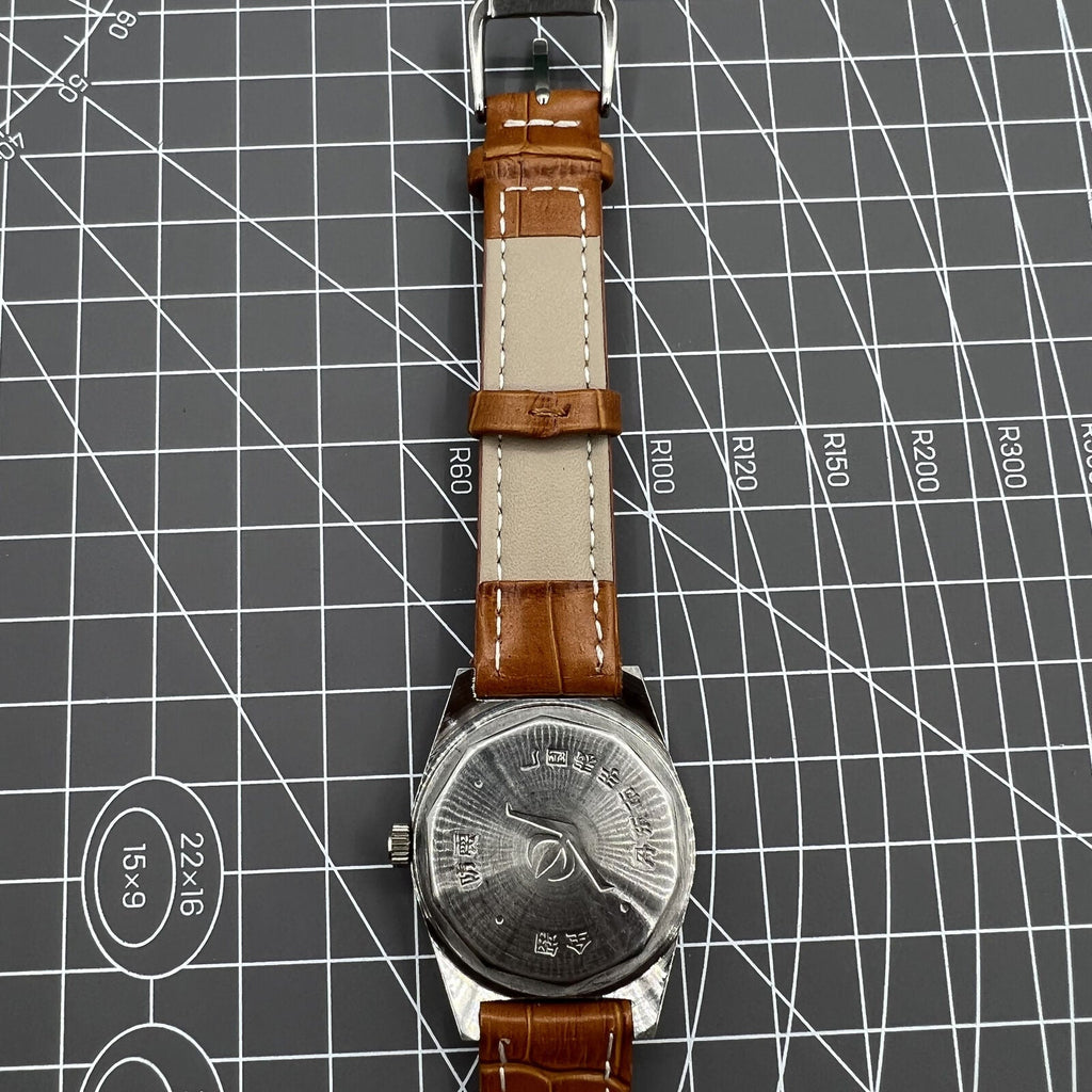 33mm Chunlan manual steel watch with silver dial, 17-jewel movement, and sleek black leather band.