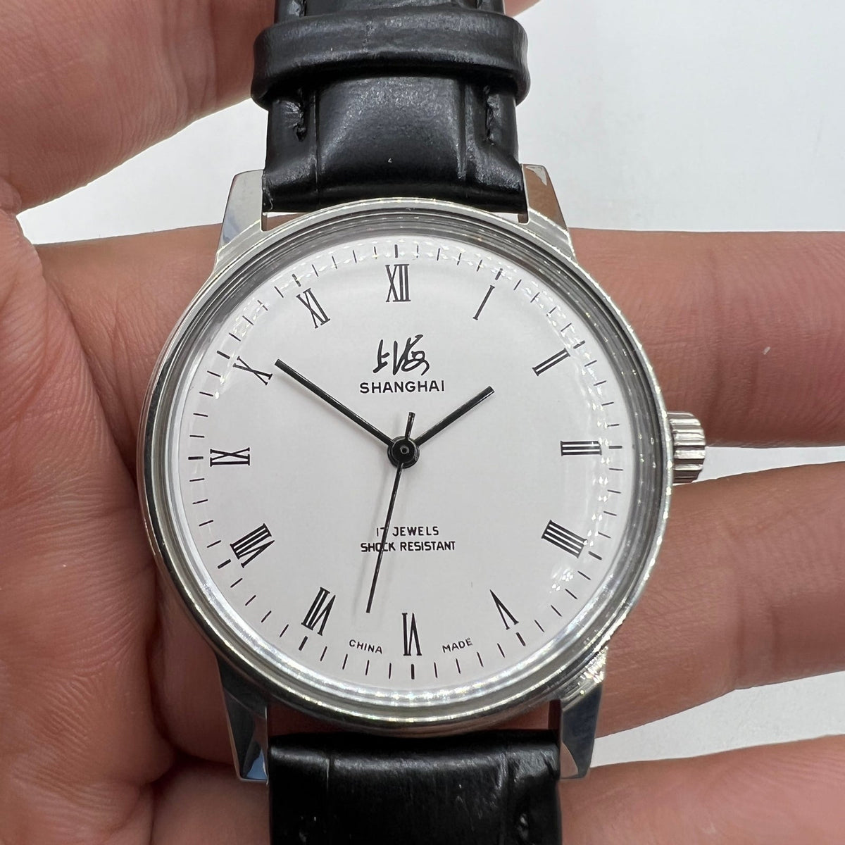 Shanghai Factory 36mm 8120 manual mechanical watch with shock-resistant 17 jewels, elegant precision timepiece by Shanghai Factory.