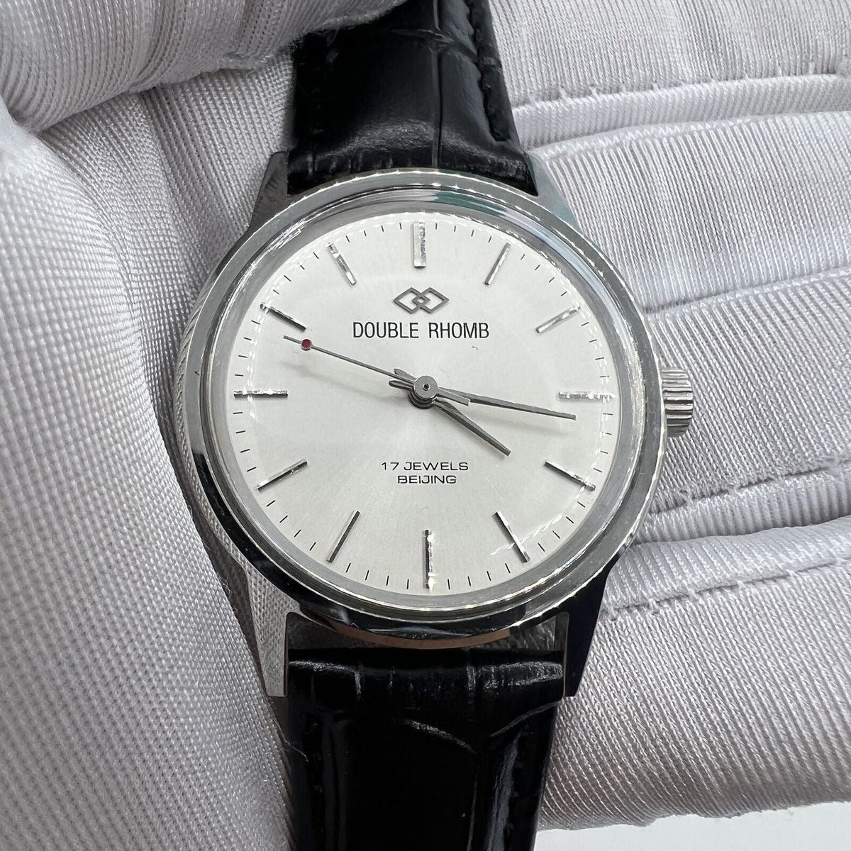 Beijing 36mm Double Rhomb manual watch with silver case and silver nail strap, classic style for elegant wear.
