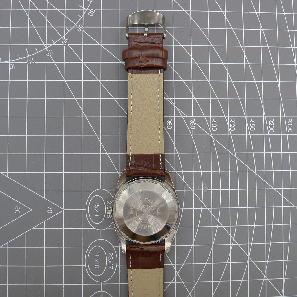 Dandong Peacock 37mm manual watch with golden dial, single calendar, 33 jewels, elegant design.
