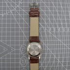 Dandong Peacock 37mm manual watch with golden dial, single calendar, 33 jewels, elegant design.